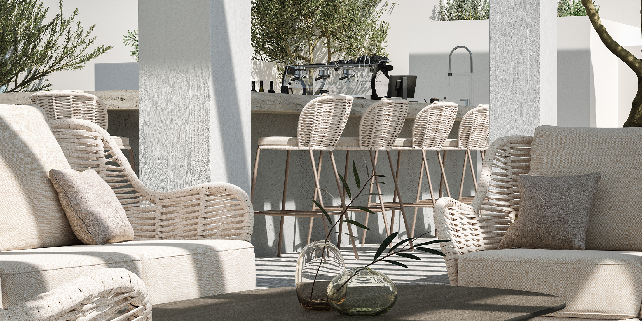 Malti Strap bar chairs pulled up to a round outdoor bar table